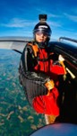 A skydiver ready to jump from a plane