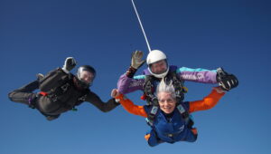 Three people on a memorial skydive