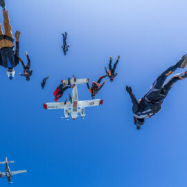 A group of skydivers photographed mid-fall