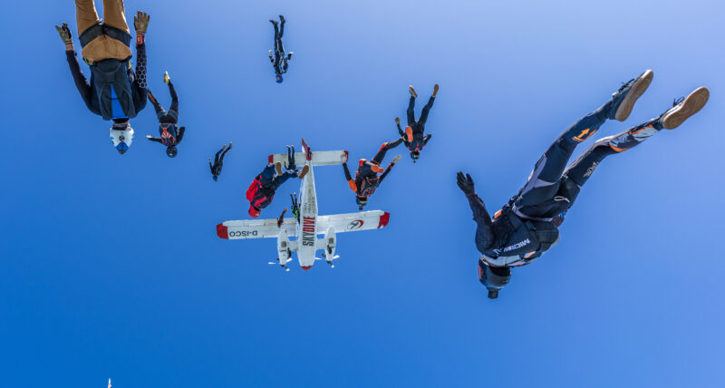 A group of skydivers photographed mid-fall