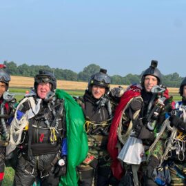A group of skydivers at a drop zone
